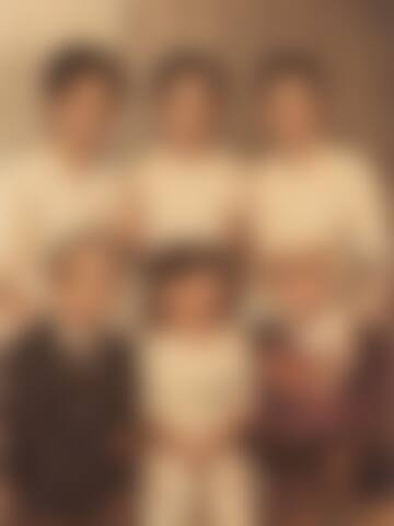 A blurred family group photograph