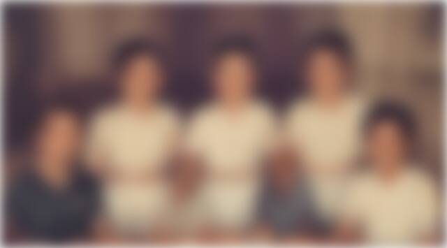 A blurred historical family group photograph
